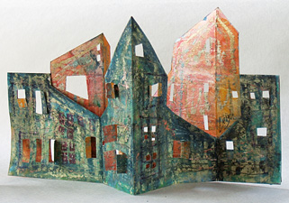 [Blue Village origami book: 3 section cut town with peaked roofs, photo courtesy of the Betsy and Charlie Zukoski collection: 58k]